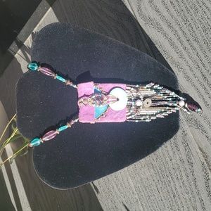 Beautiful purple and turquoise Native American beaded medicine bag.